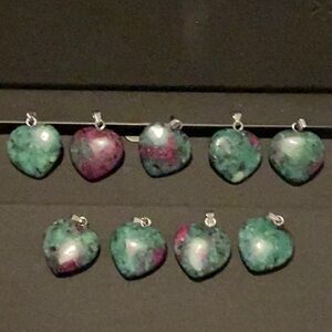 Natural crystal heart pendant.